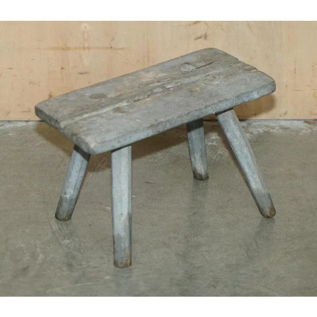 Milking Diary stool with original grey paint circa 1900. Dimensions Height:- 23.5cm Width:- 33cm Depth:- 17.5cm