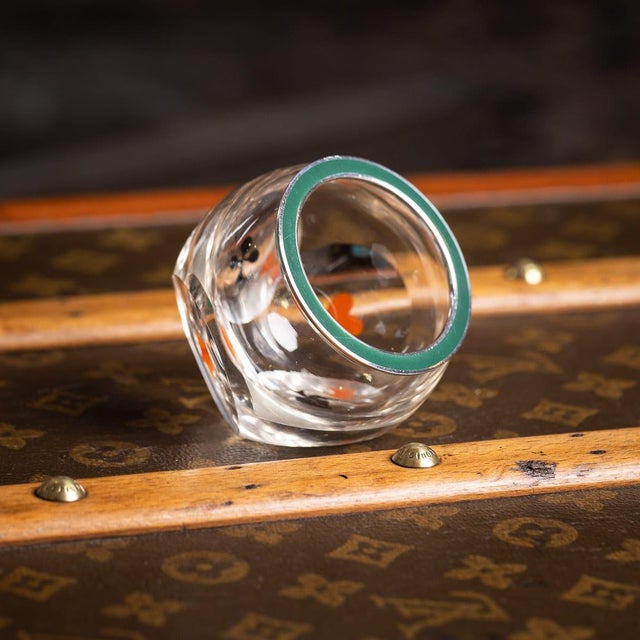 A 20th century french solid silver-mounted cut glass dice thrower. The spherical form is cut with four flat facets, each...