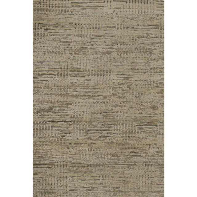 Hand-knotted in a luxurious blend of premium wool and natural silk, this 10x10 square rug is a sophisticated new addition...