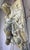 An extraordinarily evocative and rare antique French architectural fragment featuring a winged cherub, or putto, in high...
