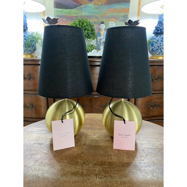 Absolutely darling little pair of Kate Spade “bubble” lamps in neutral brushed gold with original black fabric shades....
