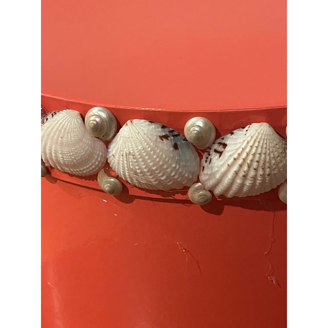 Hot pink mid century vintage paper hat box, 9” by 7”, encrusted with a border of sea shells and mother of pearl shell on...