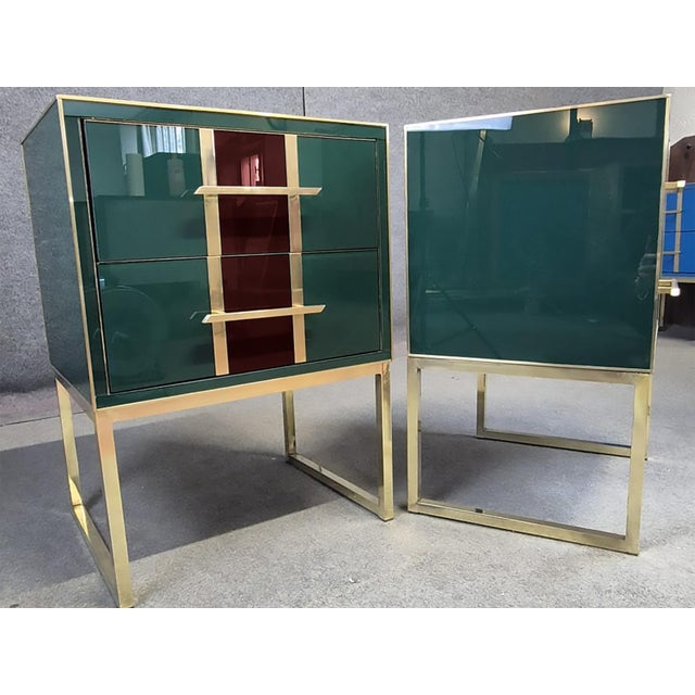 Pair of green and burgundy Murano glass bedside tables, handmade in Italy. Each table has a glossy deep-green glass body...