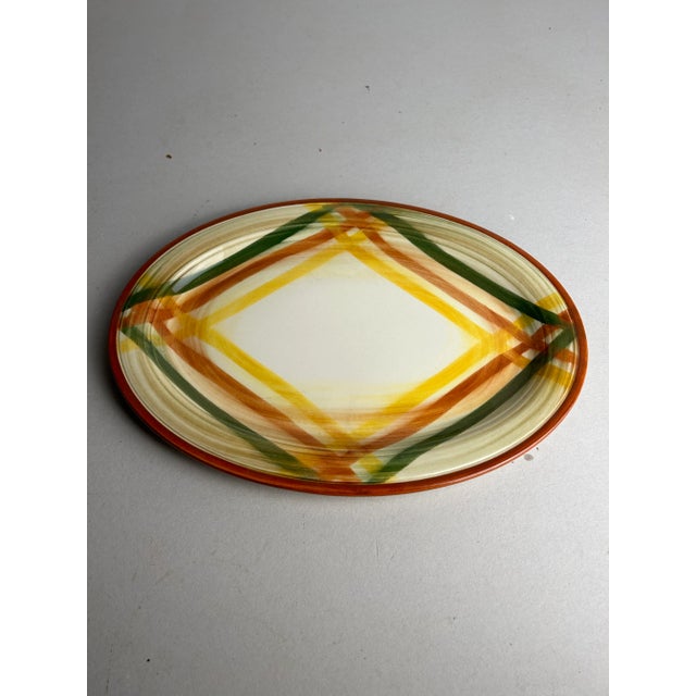 Brightly colored hand painted California dinnerware. Assorted collection includes: Oval platter 12.5" x 9.25" Round...