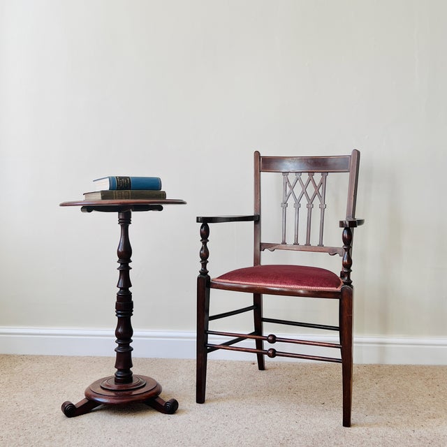 An Elegant Antique English Edwardian Inlaid Mahogany Desk Armchair Crafted during the early 1900s, this refined Edwardian...