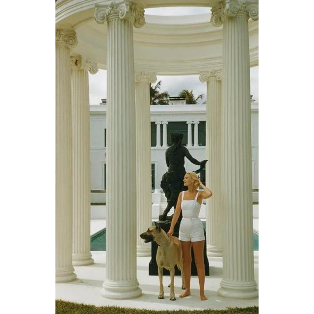 C. Z. Guest 1955 American socialite Mrs. Winston F. C. Guest (aka C. Z. Guest, 1920 – 2003) with a Great Dane at her...