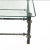 Patinated metal coffee table in the manner of Diego Giacometti. Each leg is supported by a pair of long hammered wrought...