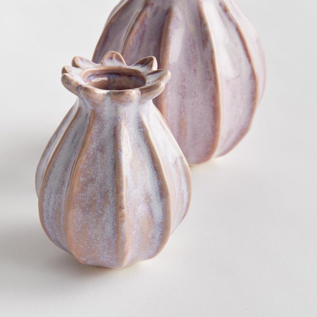 With a sculpted body and thicklyapplied reactive glaze, this pair of bud vases is a work of art. The handfinished details...