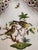 An exquisite piece of Hungarian porcelain artistry — a hand-painted Herend triangular tray in the beloved Rothschild Bird...