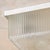 A refined study in mid-century French craftsmanship, this 1950s flush mount centers on a square Holophane glass shade  a...