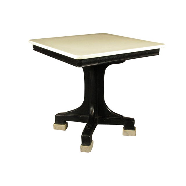 French Art Nouveau black lacquer bistro table with original white glass top and original granite feet.