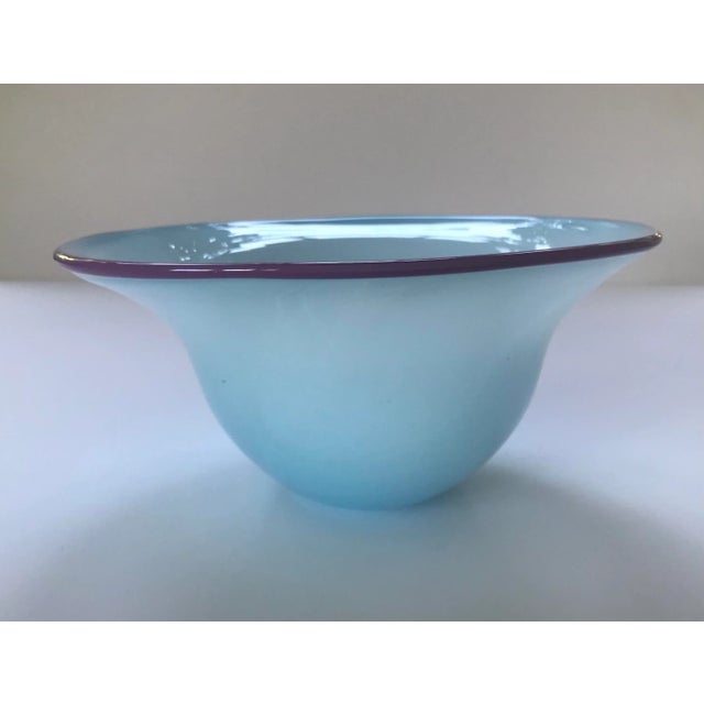 Vintage hand blown studio art glass bowl, circa 1980s. Pastel baby blue glass is nearly opaque at the base and becomes...