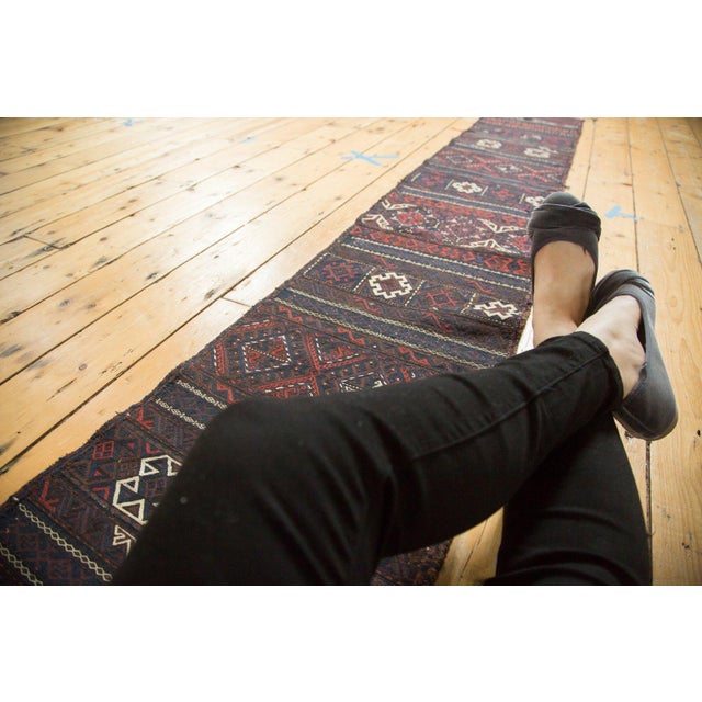 :: Unusually narrow and long belouch soumac with flat weave soumac and kilim. Fantastic contrast. Excellent classic...