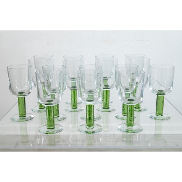 A set of 16 “Iris” crystal glass wine glasses manufactured by Rosenthal. Etched signature on bottom of each glass. The set...