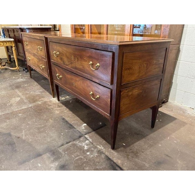 These chests are antique large scale English mahogany commodes, showcasing the traditional design of the time period. Made...