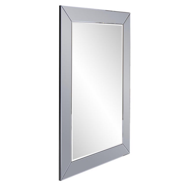 Our Auryn Mirror is a striking piece. It features a square frame of smoky gray mirrored glass. It is a perfect accent...
