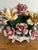 A lush and romantic Capodimonte porcelain floral centerpiece, hand-crafted in Italy and marked on the underside with the...