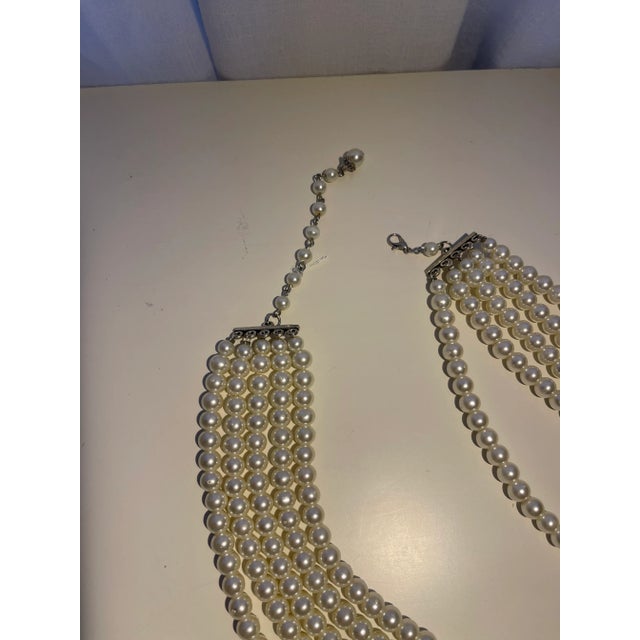 This is part of Chairish’s Costume Jewelry assortment. 5 strand pearl necklace with center antique broach.>necklace is 22"...