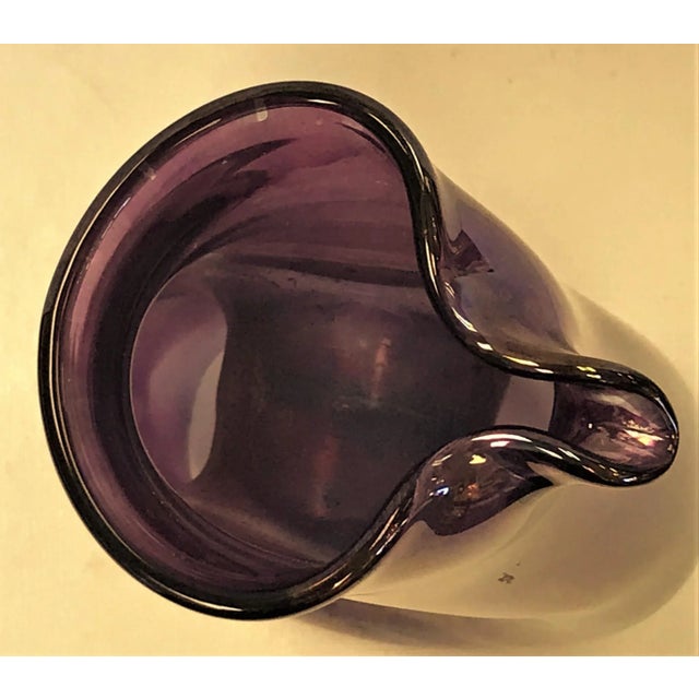Beautiful mid-century modern hand blown carafe by Tarnow of Poland. The iridescent amethyst art glass is just fabulous!...