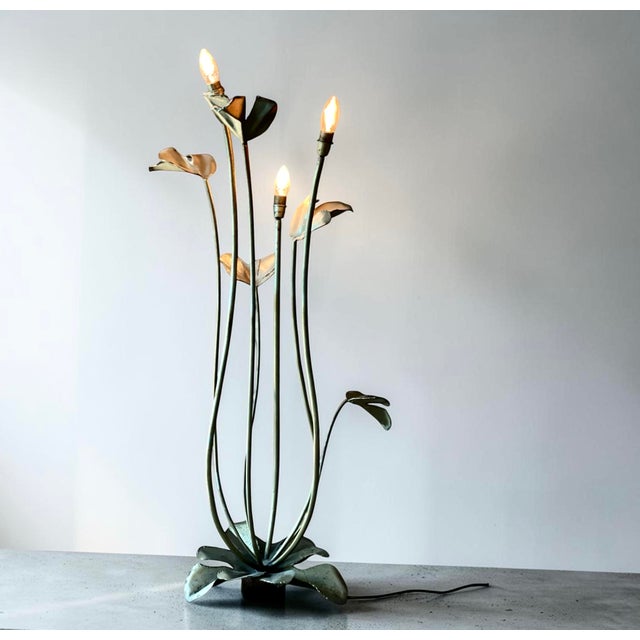 Sculptural metal floor lamp discovered in paris. the lamp is formed as a botanical composition with slender curved stems...