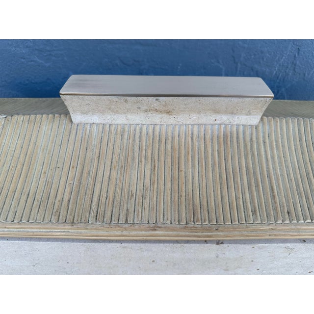 This is a Maitland Smith jewelry box, with large tessellated stone and brass. It is in good condition.