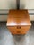 This is a vintage Danish Modern teak filing cabinet on casters, typically dating from the 1960s or 1970s.These mobile...