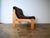 This is a 1970s pine/corduroy armchair in a brutalist style. The upholstery is very comfortable, and the pine frame is...
