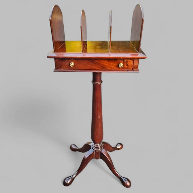 This Late 19th-century bookstand is made of lush mahogany wood and features a central column that smoothly rises to...