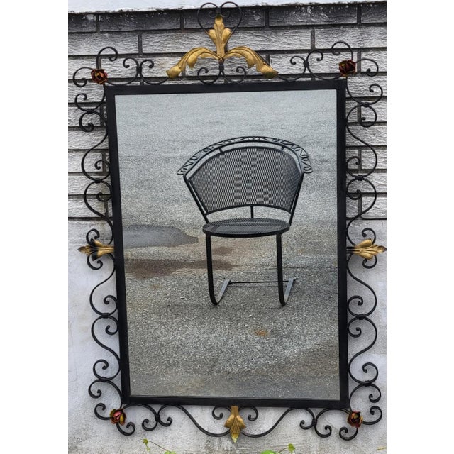 Beautiful vintage 1930s American handmade wrought iron wall mirror featuring elegant scrolling ironwork, hand-painted...