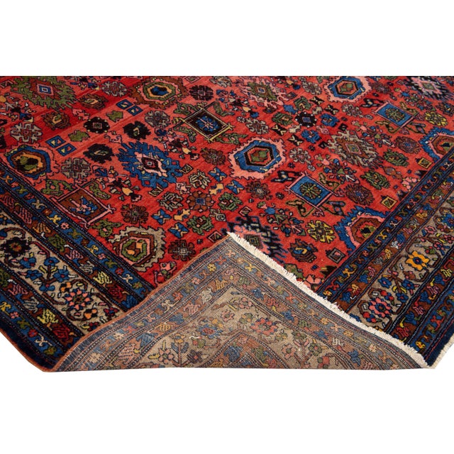 Beautiful antique Bidjar hand-knotted wool rug with a red field. This Bidjar rug has multi-color accents in the all-over...