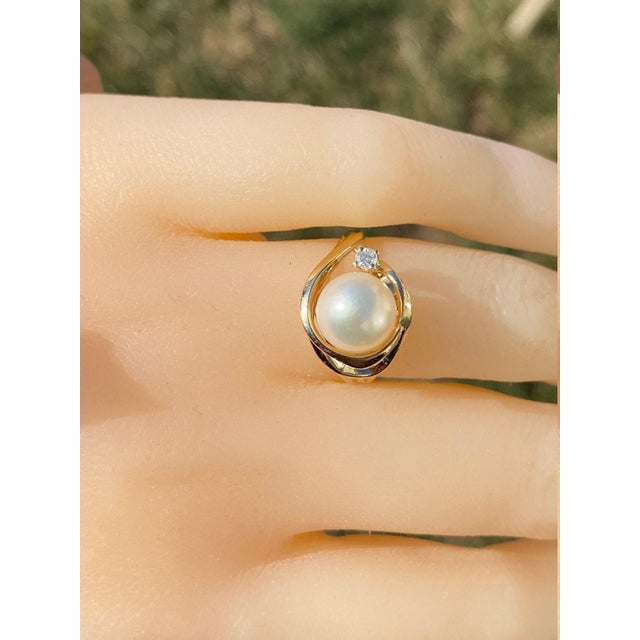The Slayden: Ladies 14K Gold Ring set with Pearl and Diamond Accent. Crafted in 14 karat yellow gold, this contemporary...