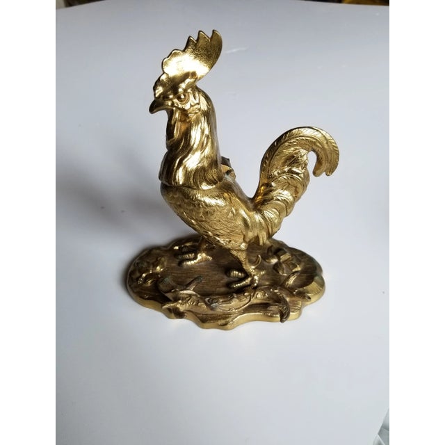 Antique Brass Inkwell with milk glass ink pot . There are also two branches to hold a writing instrument.