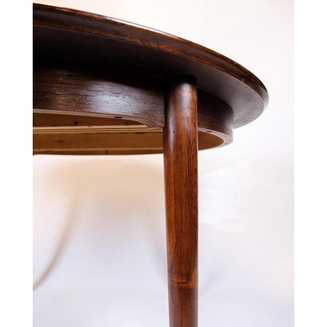Round dining table in rosewood by Arne Vodder for Sibast Møbler, 1960s. with 2 extension leaves of 50 cm. Danish design...