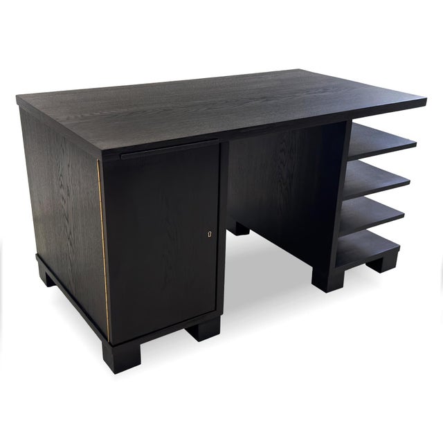 Art Deco desk dating from the 1930s. The desk is veneered in black-stained oak, emphasizing the clean geometric lines...
