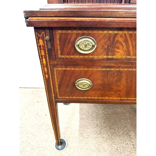 Beautiful inlaid ,mahogany tambour desk. The drawer fronts have beautiful book matched flame mahogany veneered fronts as...