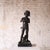 A finely cast 19th-century French bronze sculpture depicting a young boy standing in a relaxed, naturalistic pose. The...