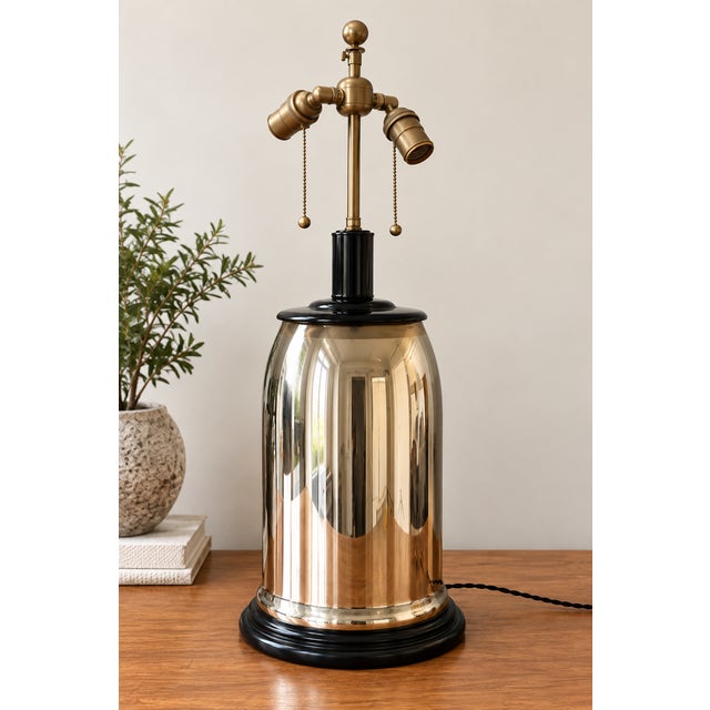 Striking vintage mercury glass table lamp, with an architectural presence. Standing 34" hight, the lamp features a...