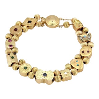 Late 20th Century Multi-Color Gems 14k Yellow Gold 11 Slide Charms Bracelet For Sale