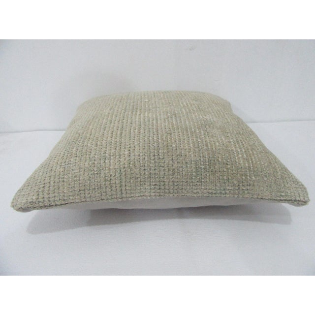 Decorative pillow cover made from a vintage Turkish handknotted rug. Backed with good quality cotton fabric. Pillow...