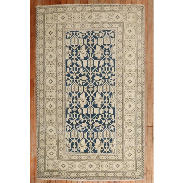 A blue and khaki vintage Caucasian perdedil rug from the2nd quarter of the 20th century Measures: 3'10" x 5'8".