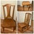 A three-piece antique set in golden oak: a rocking chair and a side chair with shaped splat backs, plus a small accent...