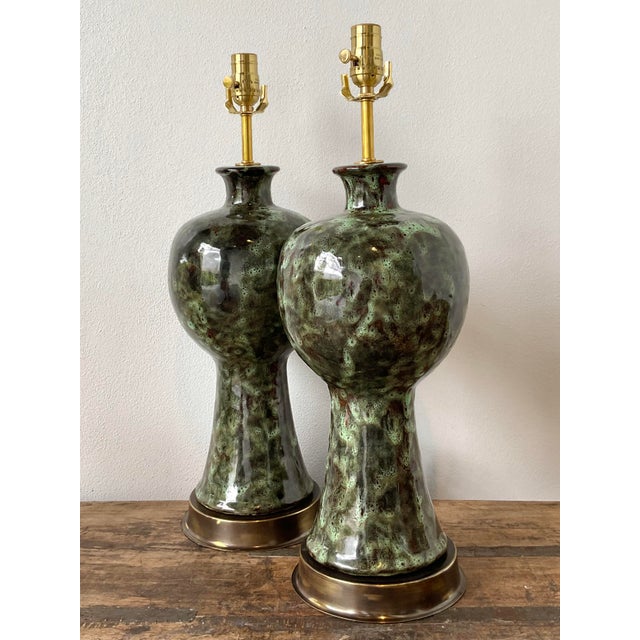 This striking pair of mid-century modern table lamps showcases the era's fascination with organic forms and experimental...