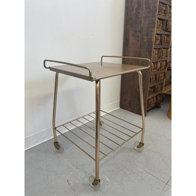 Vintage Cart 2 Tier with Rack on bottom. Clear Wheels. Vintage Condition Consistent with Age Dimensions. 18 W ; 16 D ; 24 H