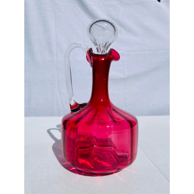 Beautiful antique Victorian hand blown art glass decanter. Stringing color with glass stopper. Perfect for sherry or other...