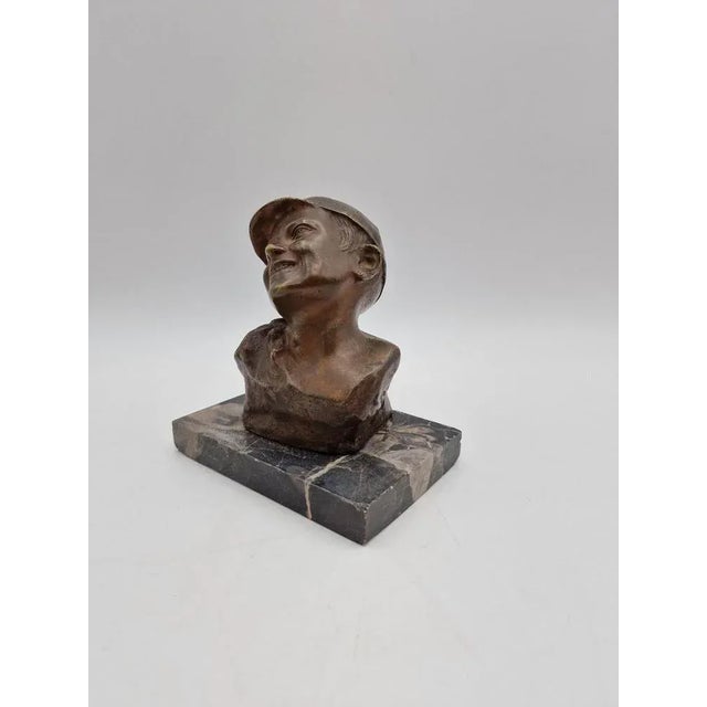 Cast in patinated bronze and signed on the back on a marble base. The sculpture is original to the period. This piece has...
