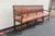 Impressive Early 20th-century Spanish Colonial style long bench featuring richly carved solid wood construction and...