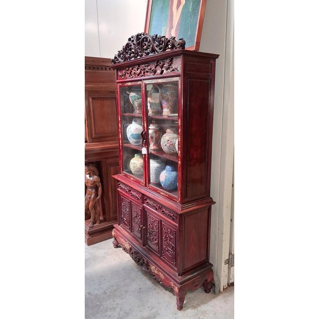 Chinese Bookcase in Carved and Gilded Red Lacquered Wood Dimensions: Height: 203 cm Width: 116 cm Depth: 36 cm An...