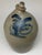 Antique salt-glazed stoneware jug is a Cowden & Wilcox piece from Harrisburg, Pennsylvania, featuring distinctive cobalt...