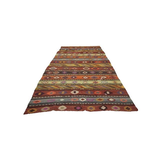 Handwoven vintage kilim rug from Denizli region of Turkey. Approximately 45-55 years old. In good condition.