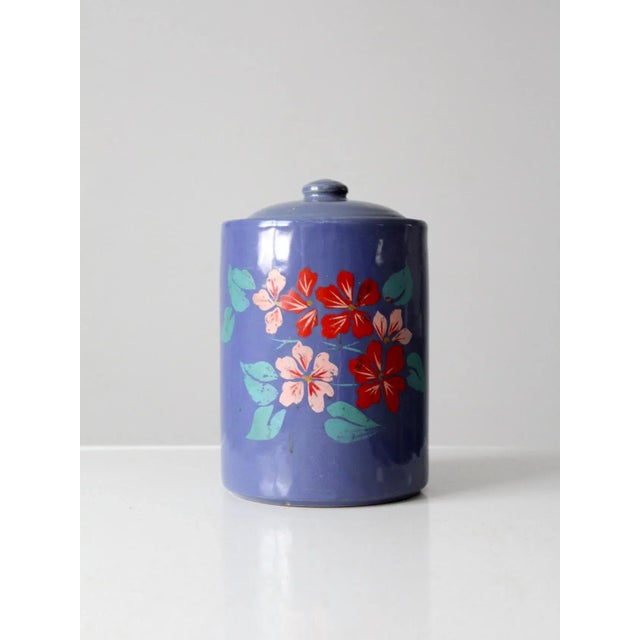 his charming 1930s-era cookie jar is crafted from vintage stoneware and features hand-painted pink and red flowers on the...